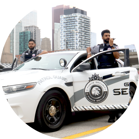 G Force Security patrol vehicle and security guards at a commercial property