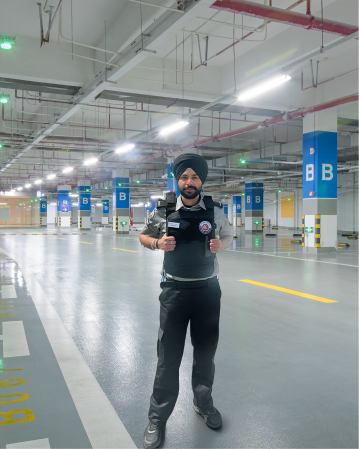 Security guard on patrol in an underground parking garage